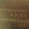 Shotgun carved part of the manufacturer's name