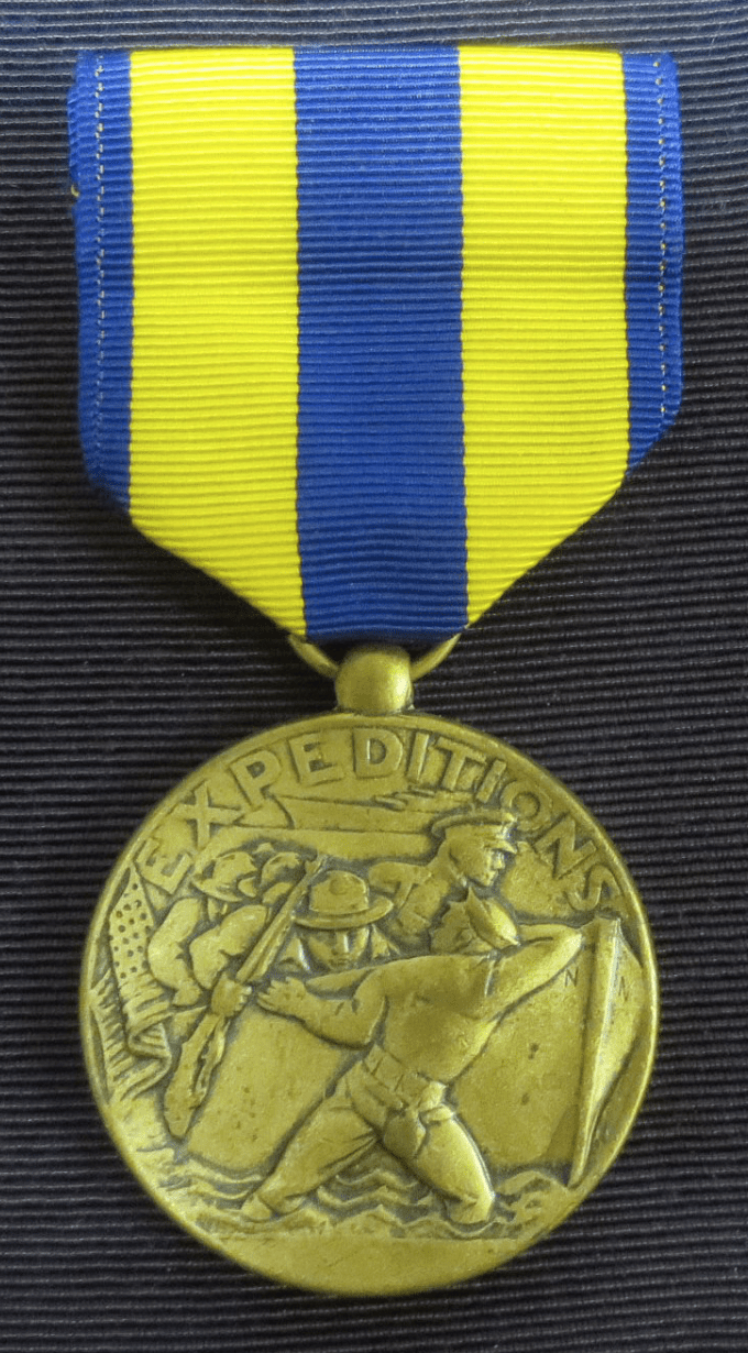 Gold medal with yellow and blue ribbon