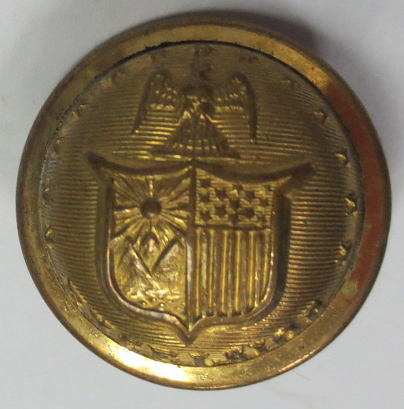 Shield on a gold button