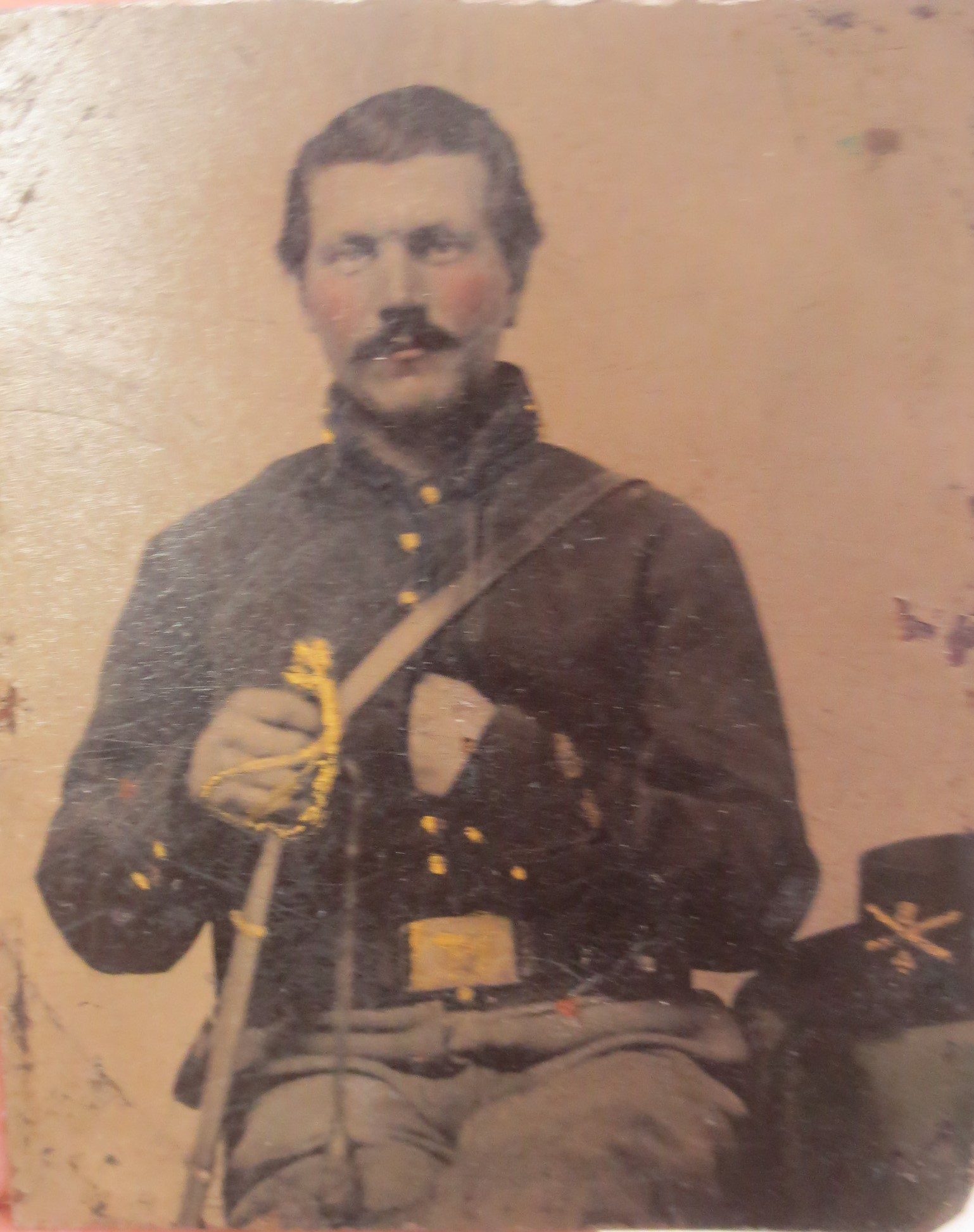 Image of a soldier seated wearing cavalry shell jacket
