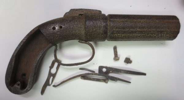 Dismantled curved pistol