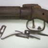 Rusty revolver with its parts