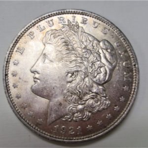 Close up photo of coin containing the face of liberty in side view