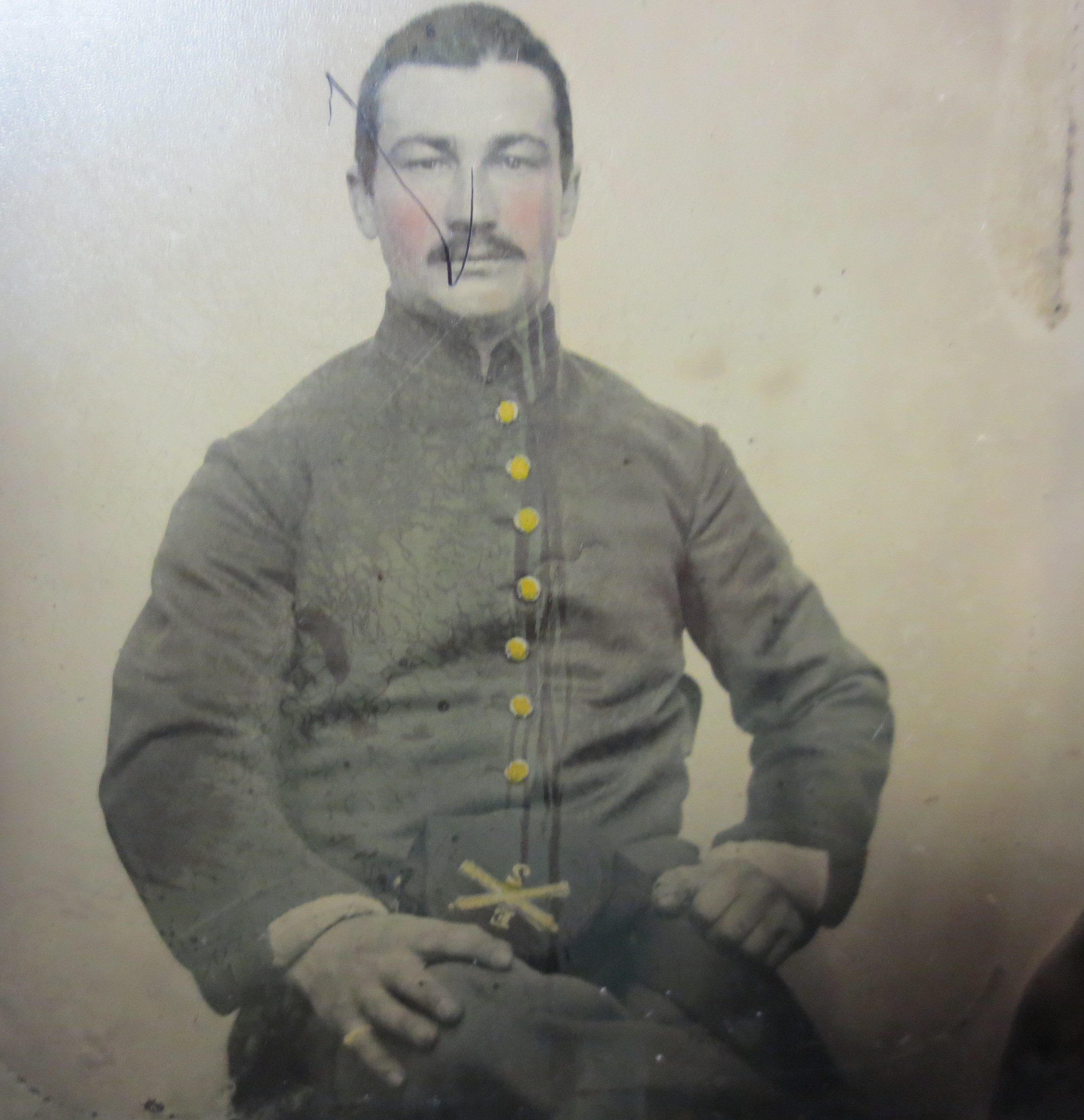 Black and white photo of a man with yellow buttons