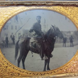 Picture of a man riding a horse inside frame