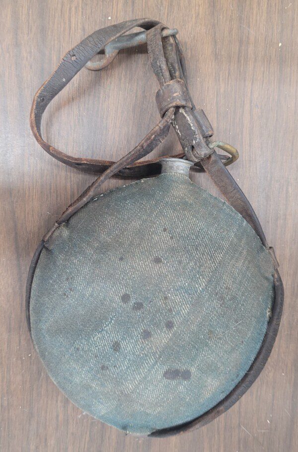 Fine Civil War blue covered cavalry canteen with original leather saddle hanger!