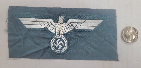 Original WWII Nazi German uniform eagle emblem, unissued condition